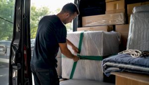 Mover securing furniture load inside van