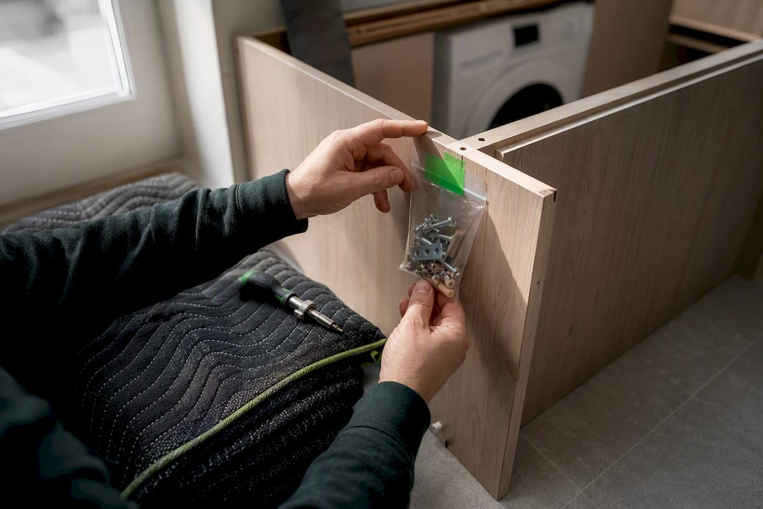 Furniture fixings secured beside disassembled panel