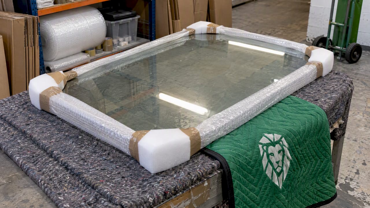 Glass tabletop protected with padded edge wrapping
